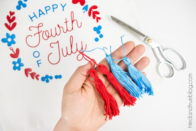 Four red and blue tassels to be used on Fourth of July Pillow Cover