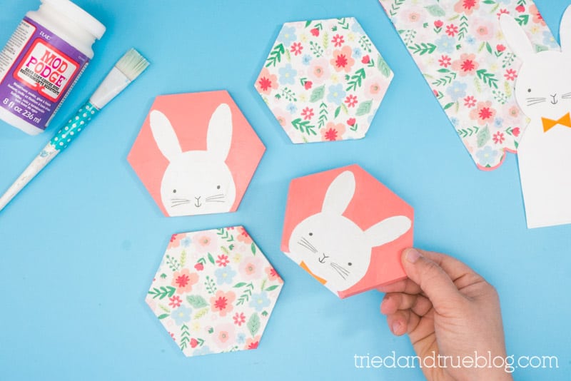 Hand holding Easter Bunny Decoupage Coasters.