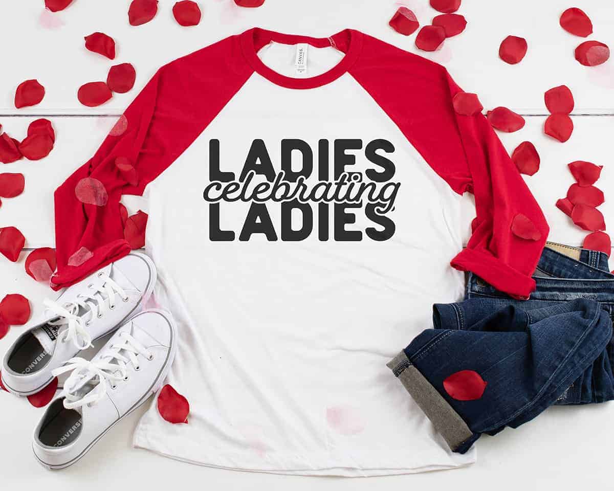 Red and white raglan t-shirt with black vinyl lettering 