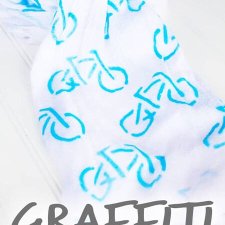 Super easy way to make a Graffiti Bicycle Scarf! Technique can be used with any thrift store scarf and stencil!