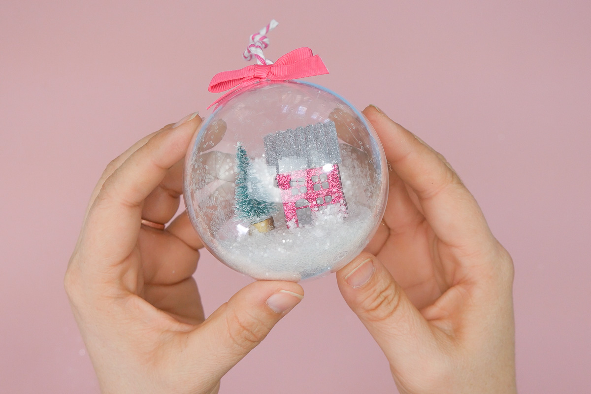 Hands holding completed Mini Snow globe Ornament.