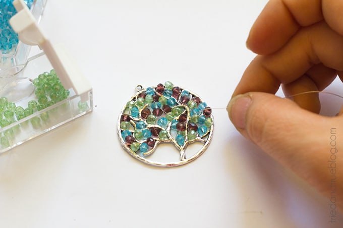 Continue adding beads onto pendant