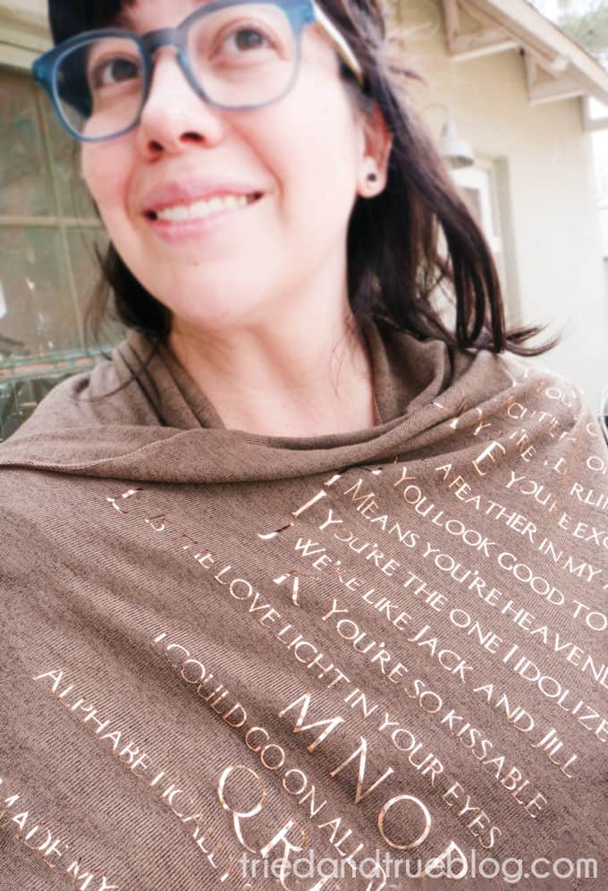 Woman wearing the Mother's Day Song Scarf outside