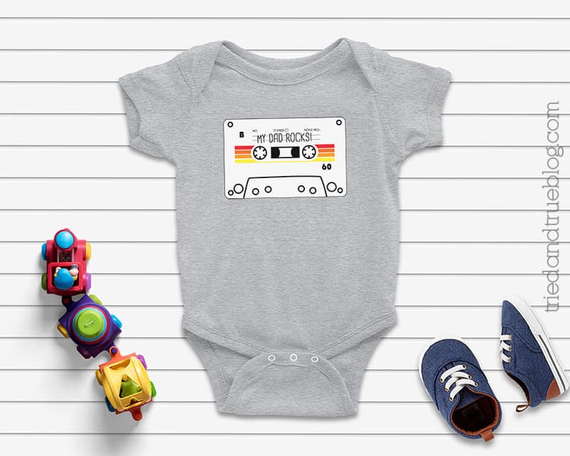 Gray baby onesie with a Cassette Tape Father's Day Card Free Printable that says 