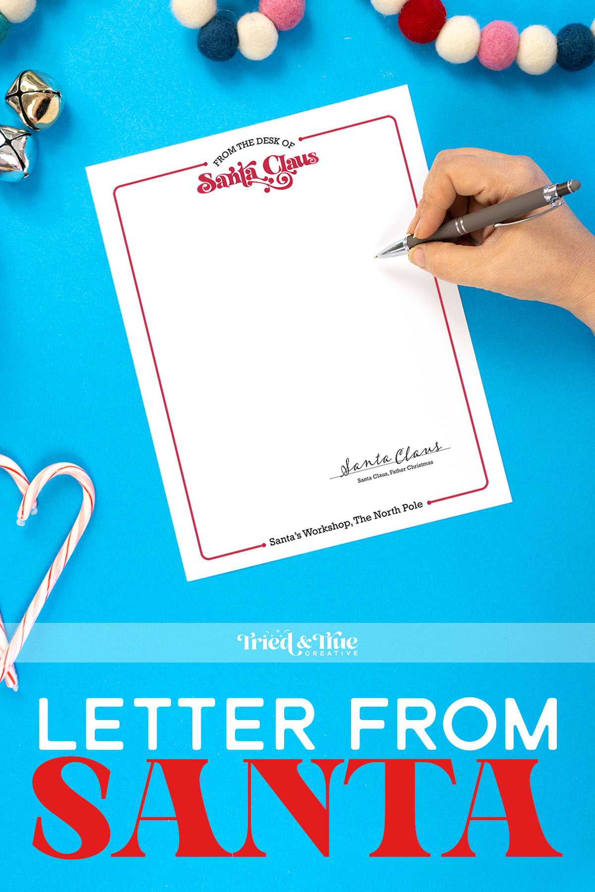 Hand writing on a letter from Santa on a blue background
