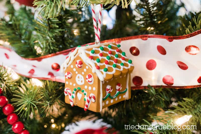 Clay Gingerbread House ornament hanging on a lighted tree.